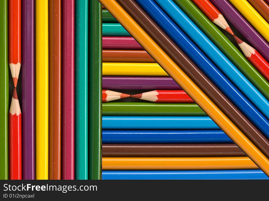 Many colored pencils abstract background