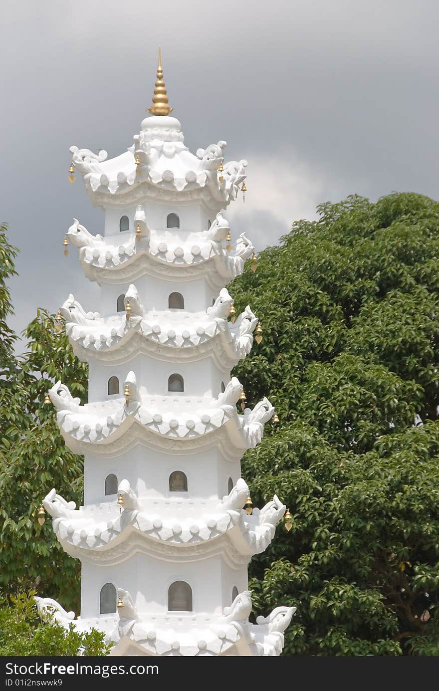 Small buddhist shrine tower in a forest