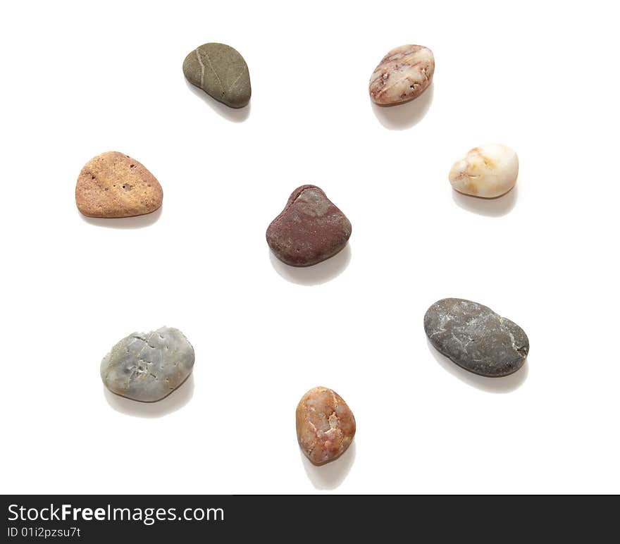 Colored stones for spa procedures on a white. Colored stones for spa procedures on a white.