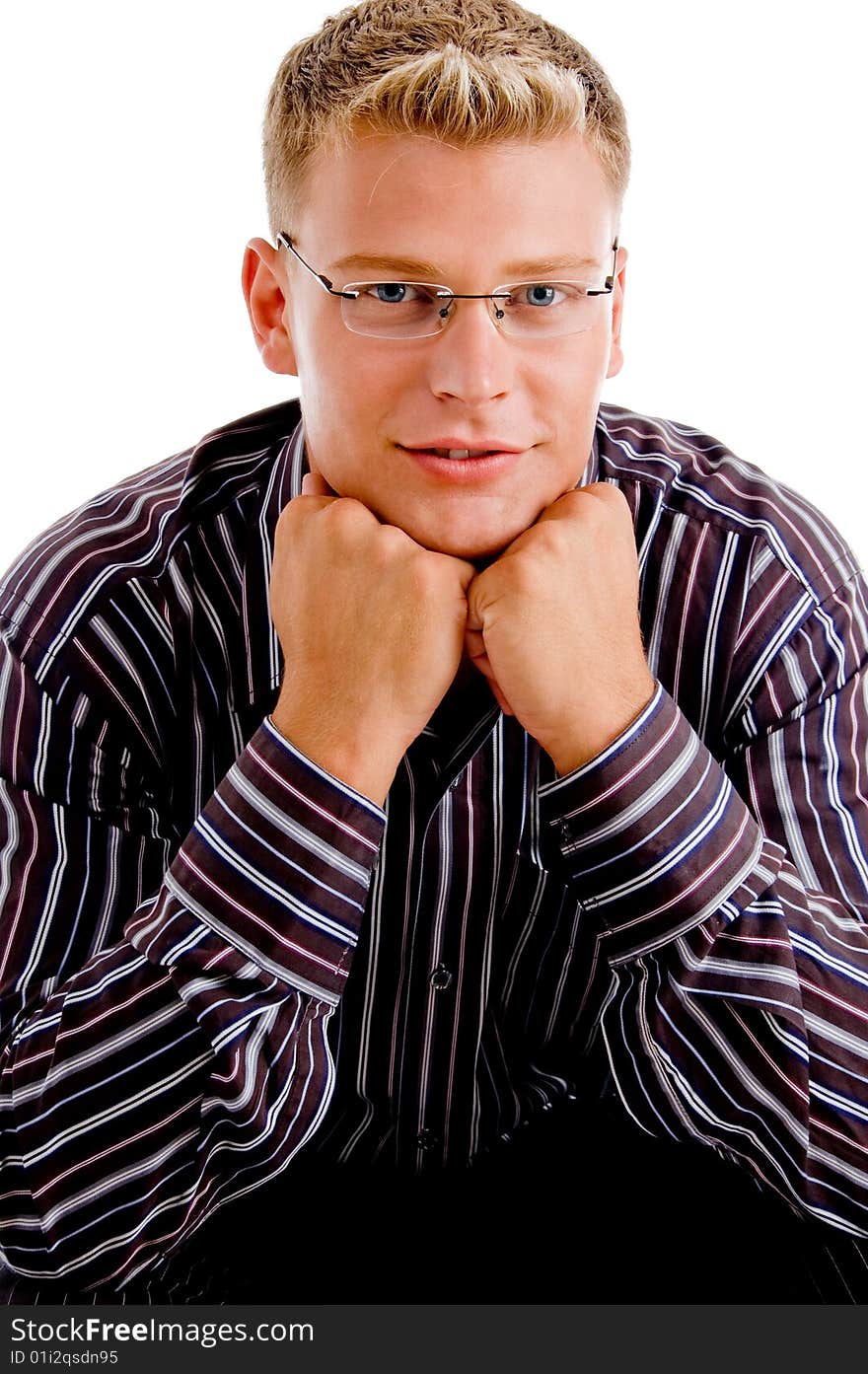 Close up pose of attractive man posing with clenched fists