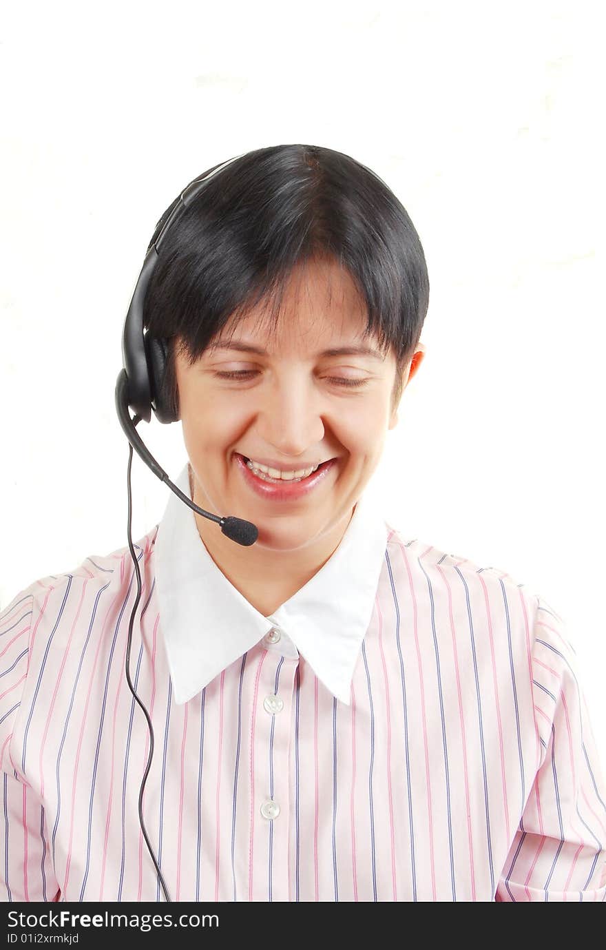 The businesswoman, who talks by a phone, is isolated on a white background. The businesswoman, who talks by a phone, is isolated on a white background