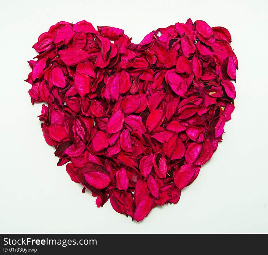 Heart made with red rose petals