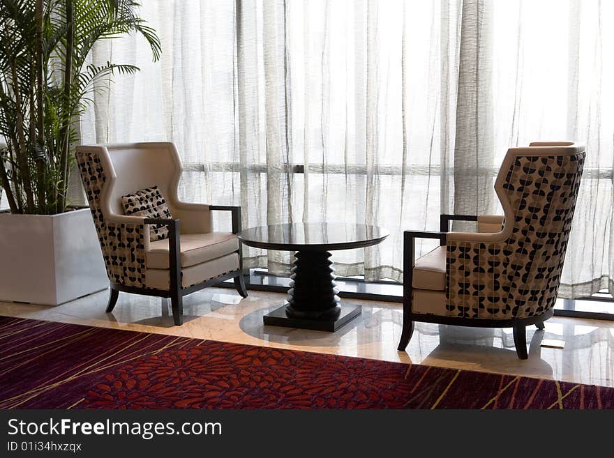 Two modern armchairs in a hotel lobby. Two modern armchairs in a hotel lobby