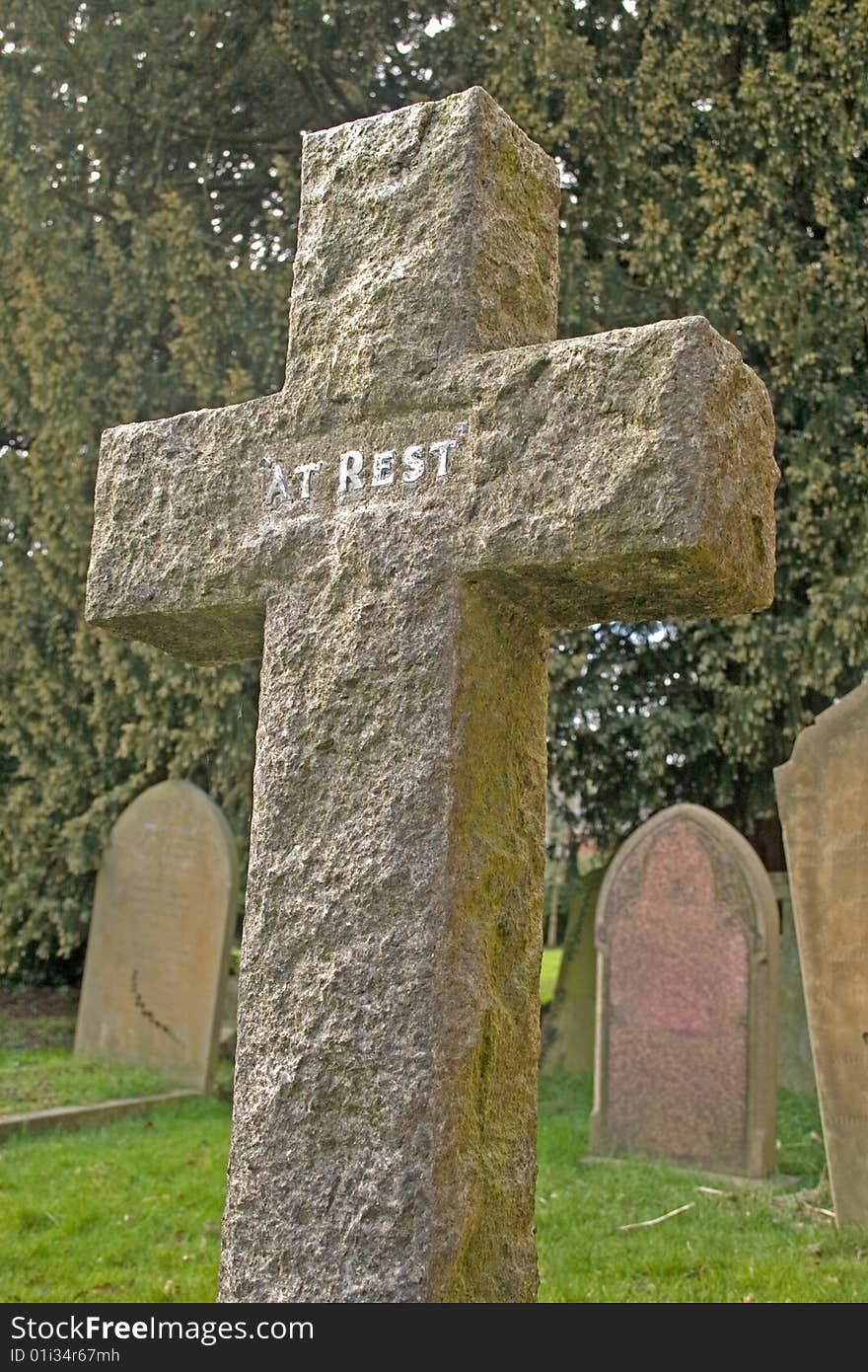 Cross Gravestone In A Cemetery