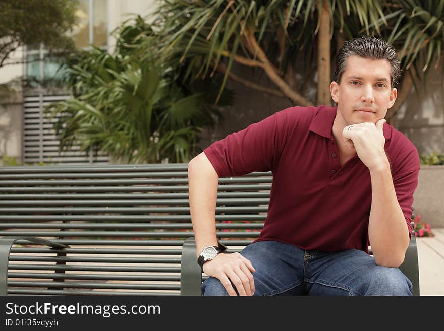 Young businessman on a bench. Young businessman on a bench