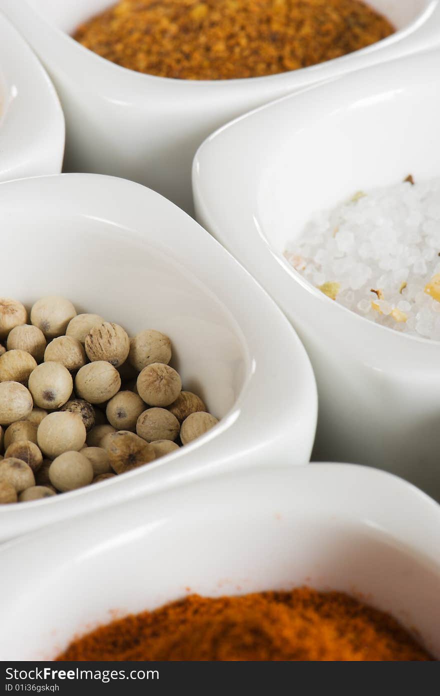 View over several pots with ground spices