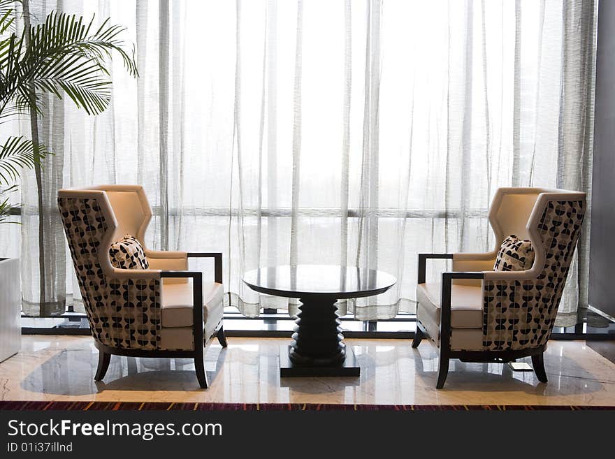 Two modern armchairs in a hotel lobby. Two modern armchairs in a hotel lobby