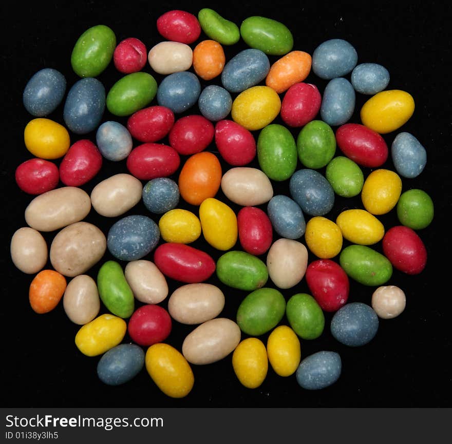 Colorful candies isolated on a black background