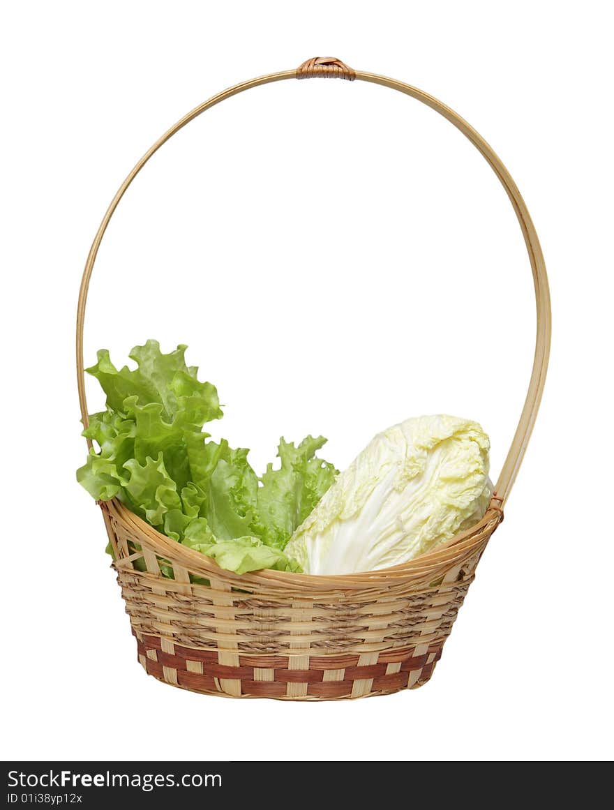 Basket with salad and cabbage isolated on a white background