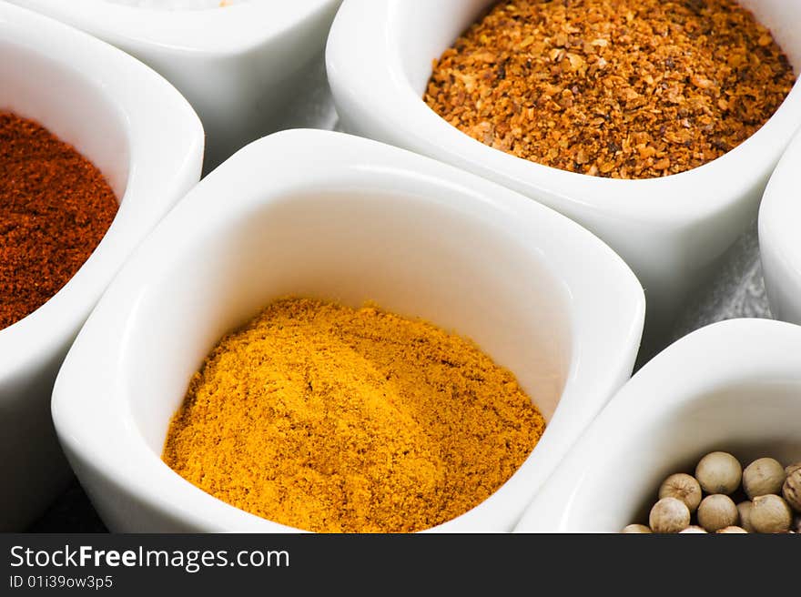 View over several pots with ground spices