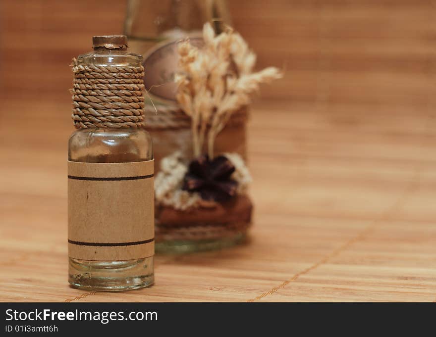 Two spa oil bottles decorated