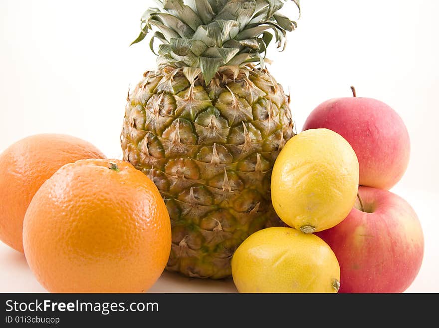 Pinapple, oranges, lemons and apples isolated. Pinapple, oranges, lemons and apples isolated.