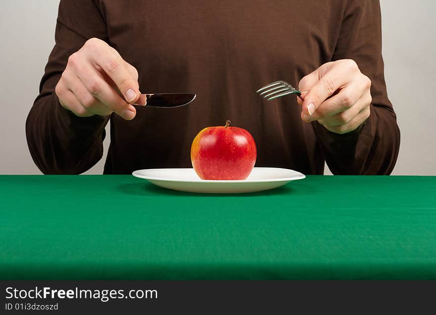 Photo of a man going to eat an apple. Photo of a man going to eat an apple