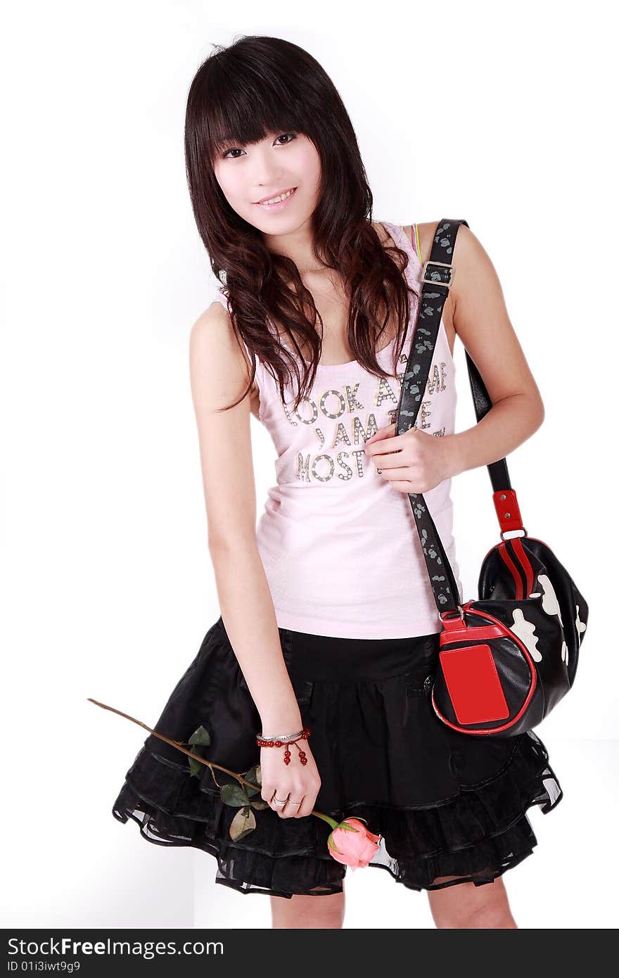 A beautiful Asian girl with handbag on white background. A beautiful Asian girl with handbag on white background.