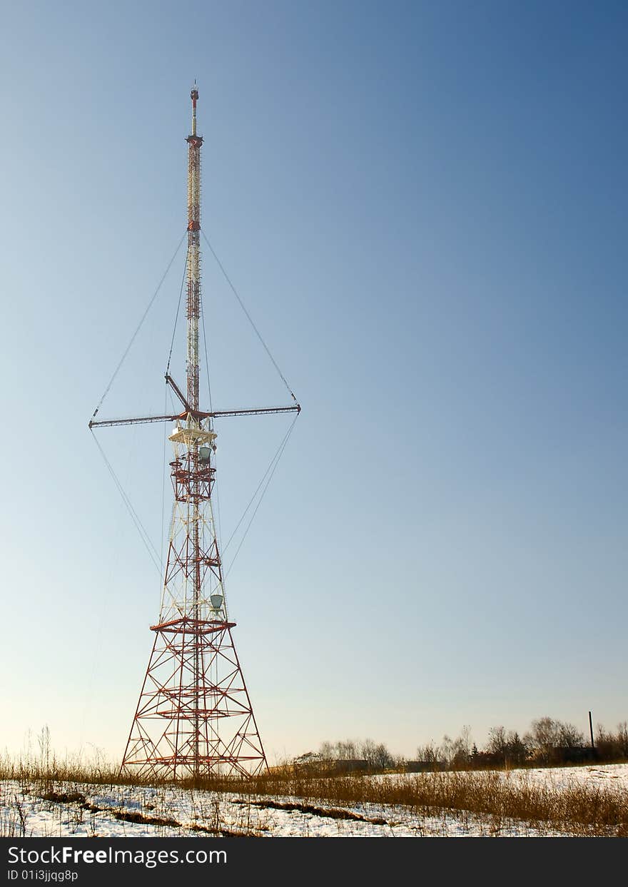 Red And White Antenna In Spring Field