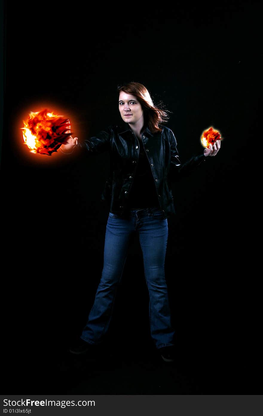 Teenage Girl Holding Fireballs In Her Hands