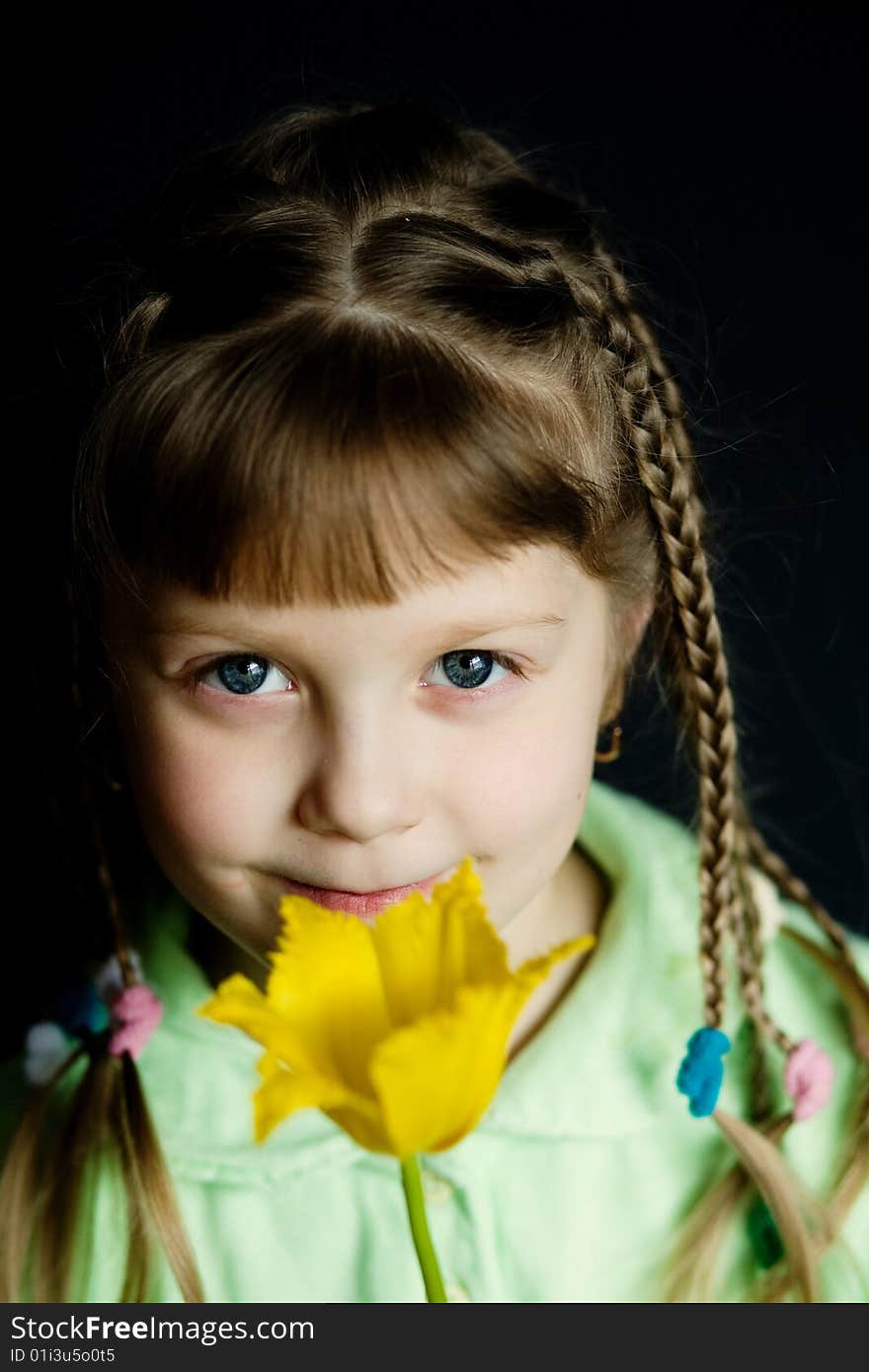 Stock photo: an image of a nice girl with a yellow flower. Stock photo: an image of a nice girl with a yellow flower