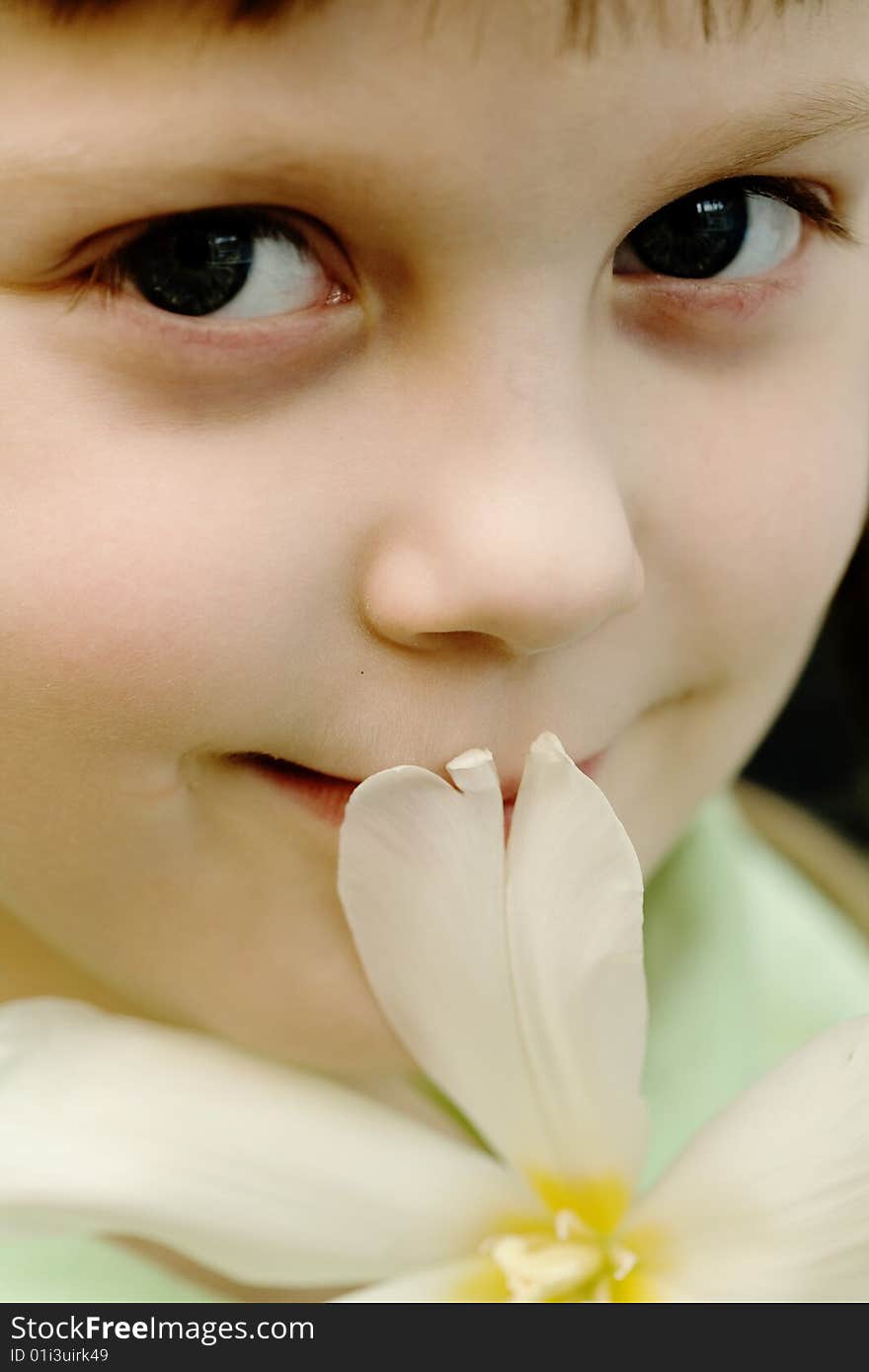 Stock photo: an image of a beautiful girl with a flower. Stock photo: an image of a beautiful girl with a flower