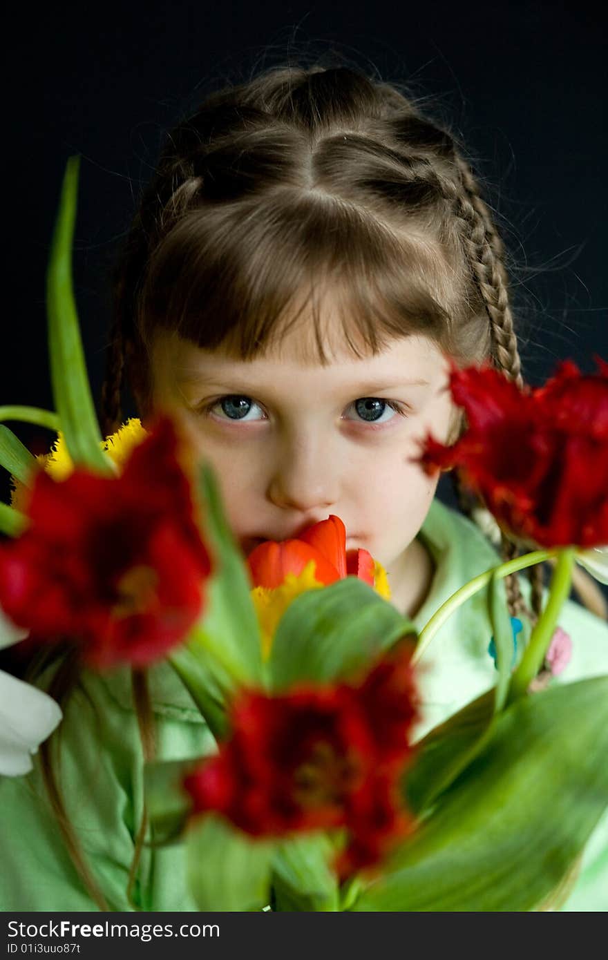 Stock photo: an image of a girl with a bunch of flowers. Stock photo: an image of a girl with a bunch of flowers