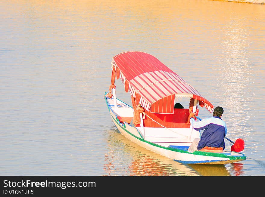 Tourist boat in dull lake at kashmir india.