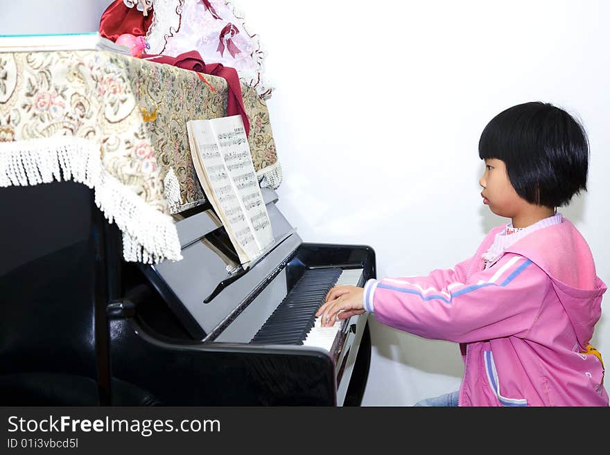 A child is playing piano