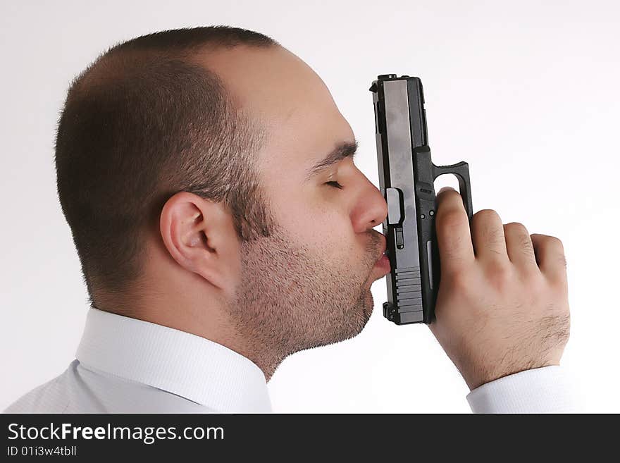 Man Kissing A Gun