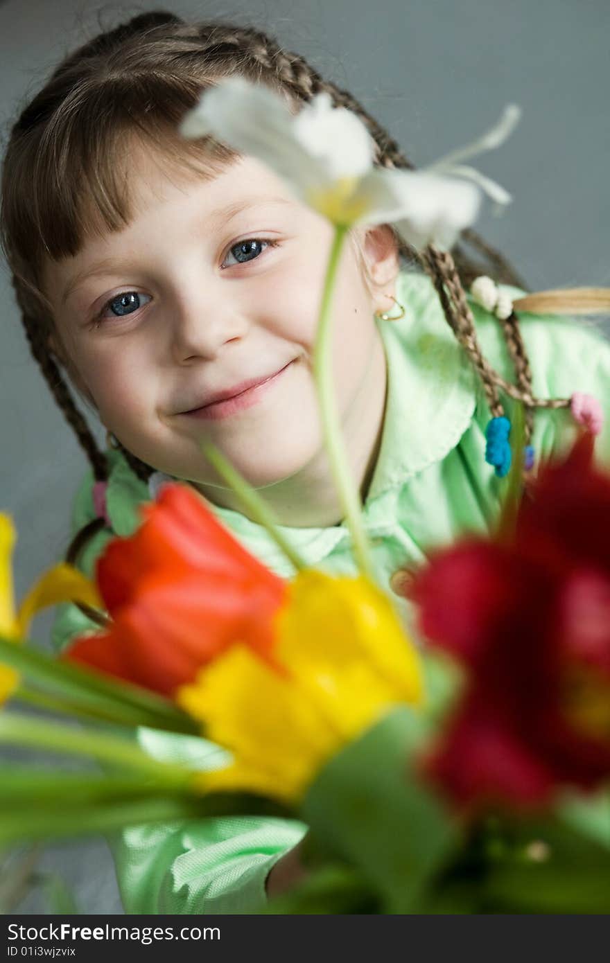 Stock photo: an image of a happy girl with tulips