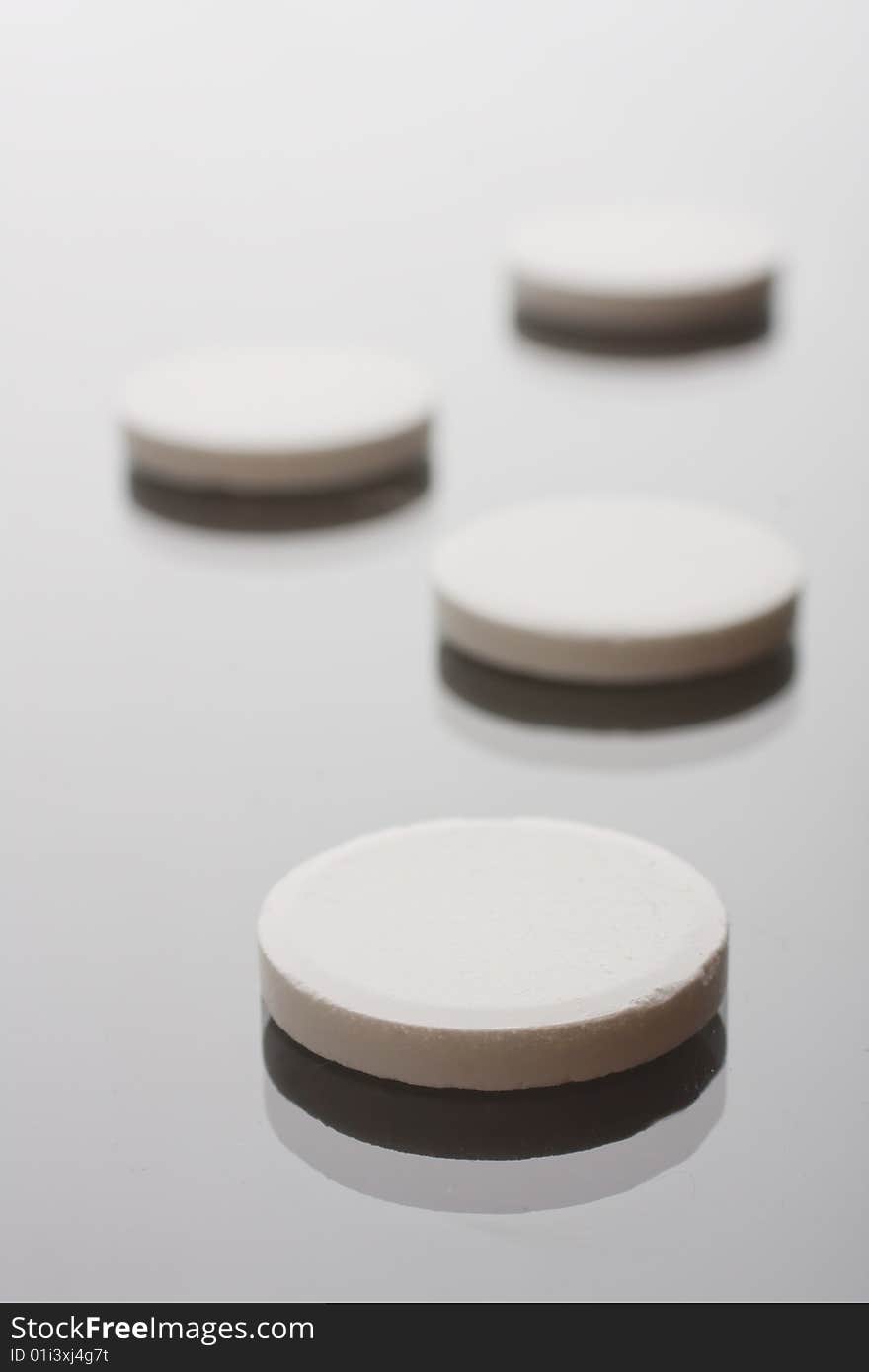 Macro of pills on glass background