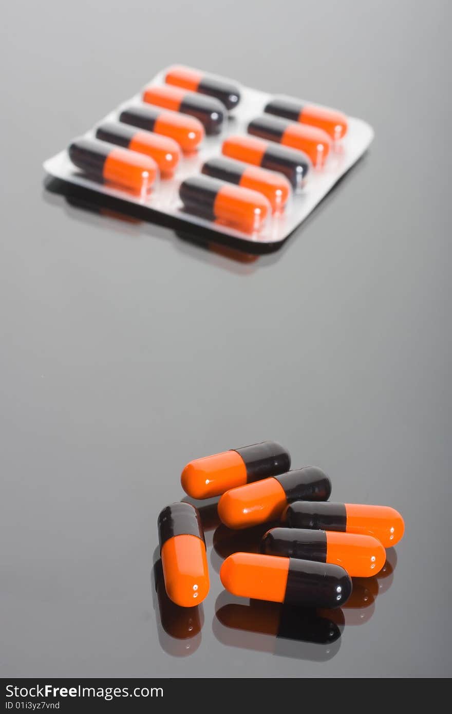 Macro of pills on glass background