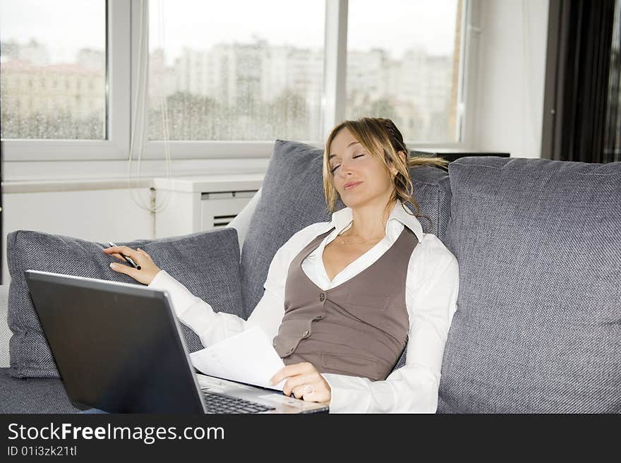 Beautiful businesswoman working at home