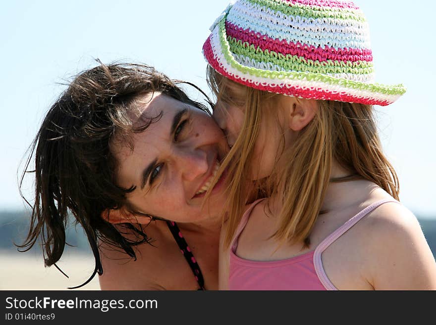 Woman and girl at the beach