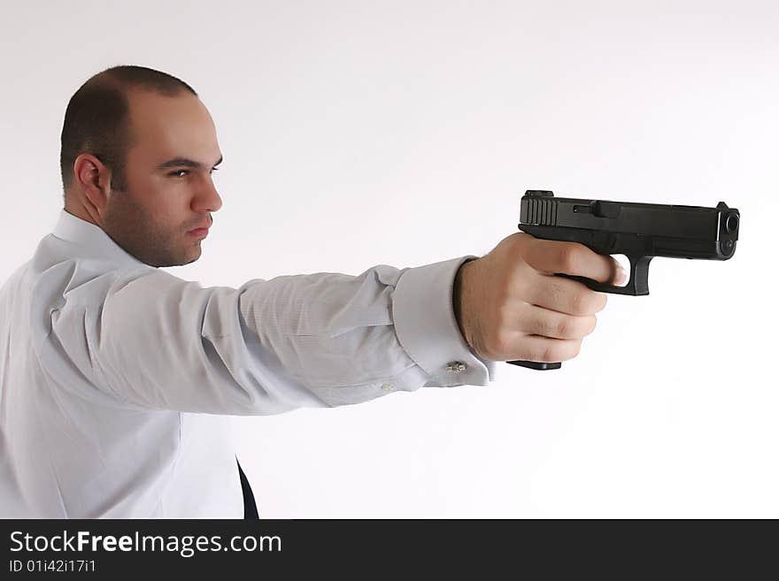 Profile of a man with gun in his hand. Profile of a man with gun in his hand