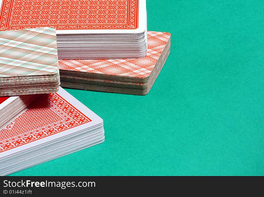 Deck of playing cards on green background