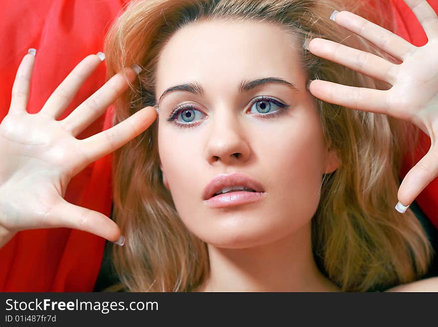 Beautiful blonde with a red scarf on a head. Beautiful blonde with a red scarf on a head