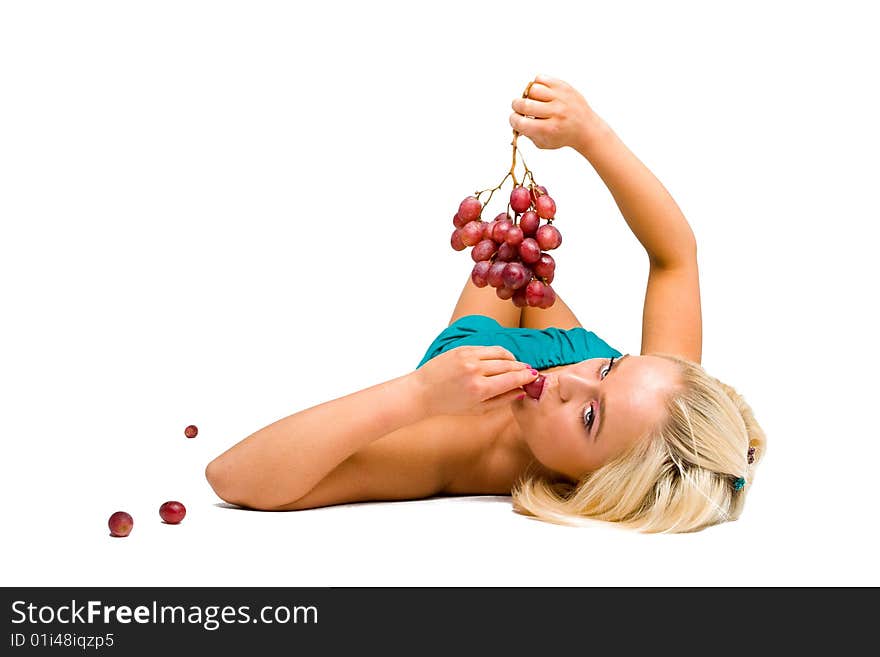 Blonde girl in blue with grapes