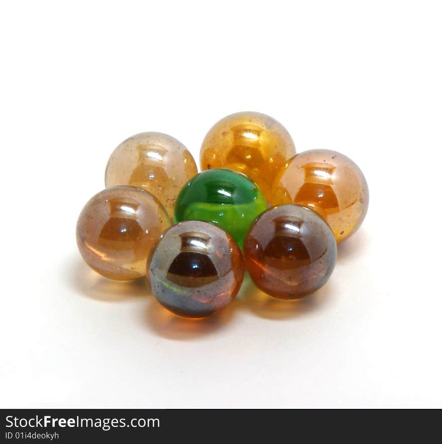 Varicoloured abstract glass balls on a white background