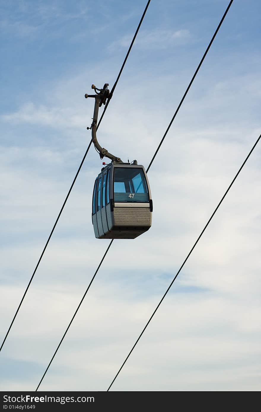 Cable Car against lightly clouded sky