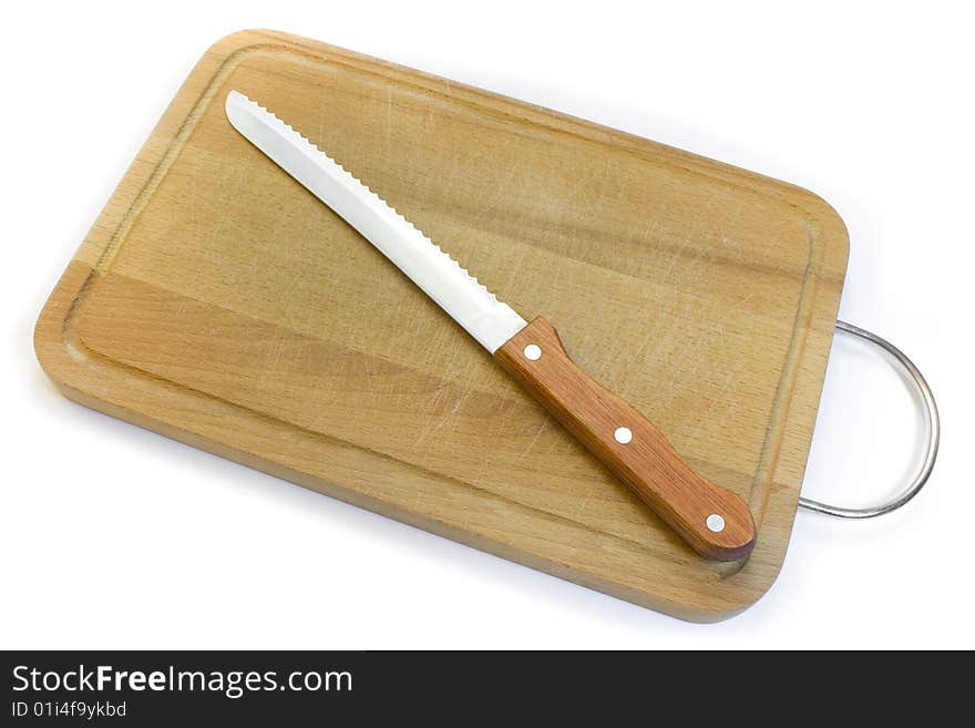 Chopping board and knife for bread, a photo close up on a white background.