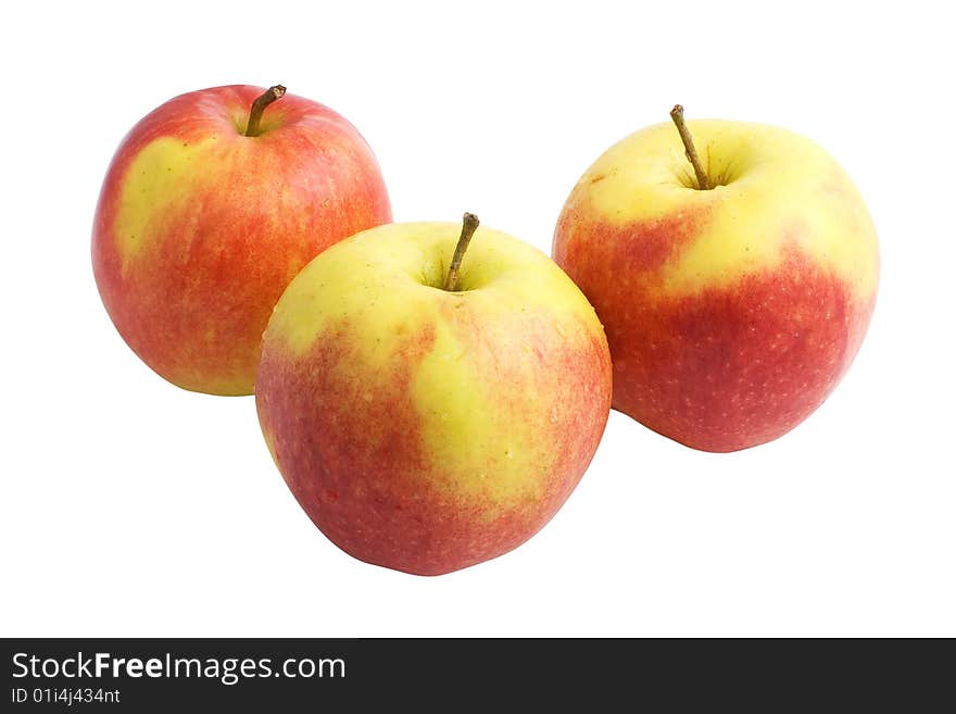 Three red and yellow apples isolated on white background