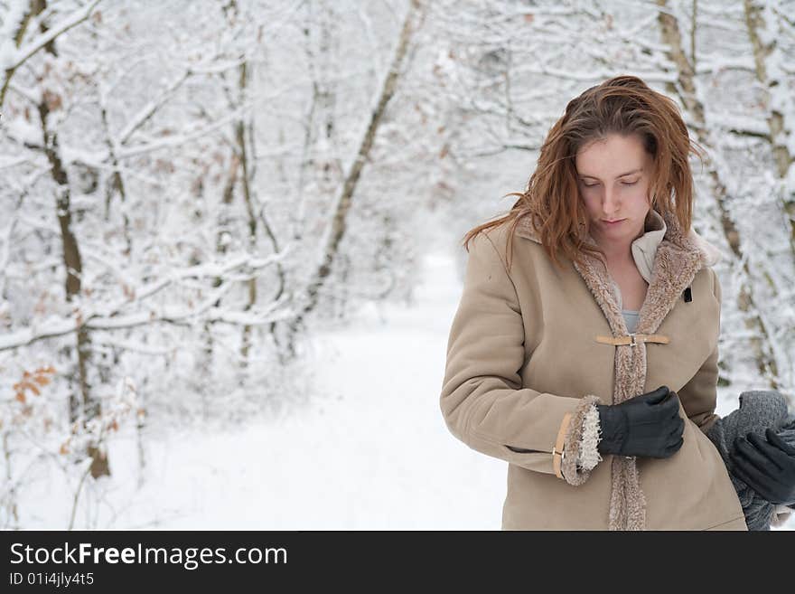 Winter landscape woman standing in the snow