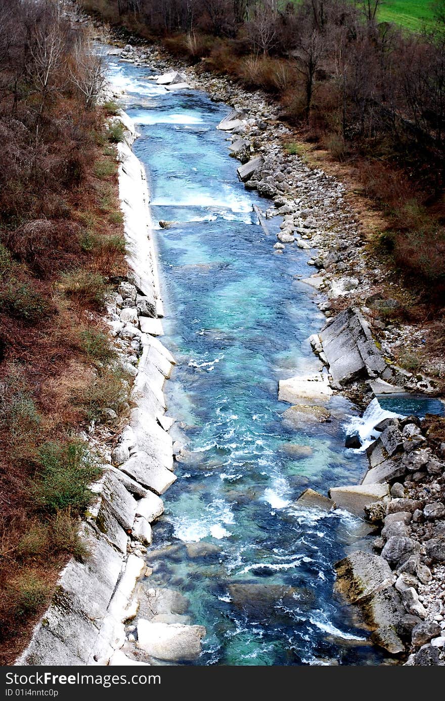 Torrent and blue water in the winter season