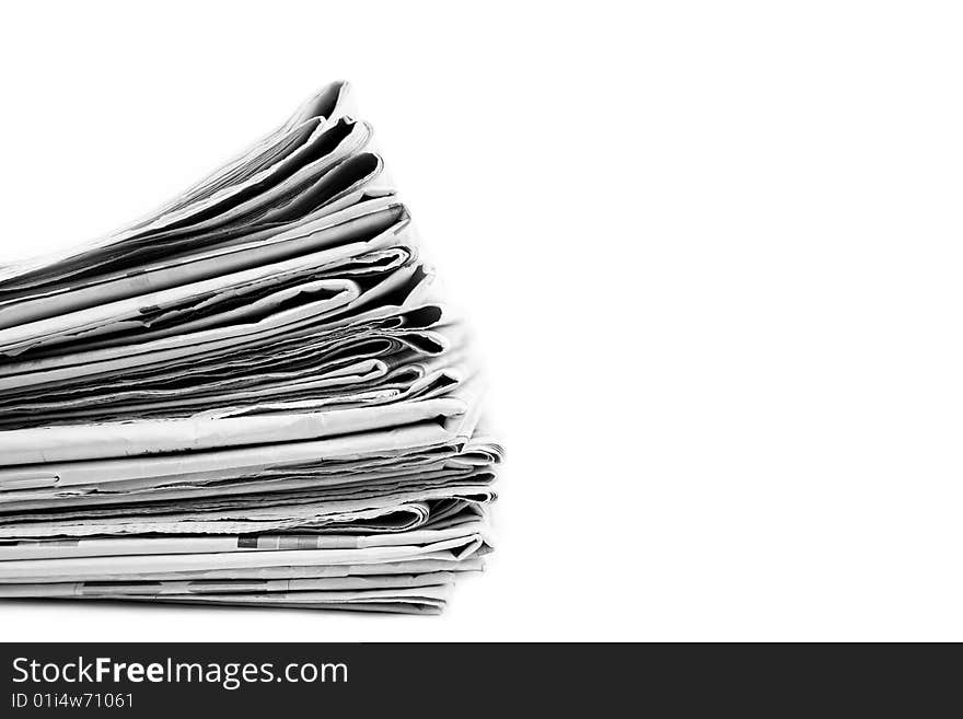 Stack of newspapers in black and white isolated