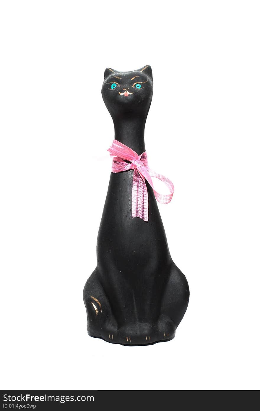 Black cat statuette under the white background