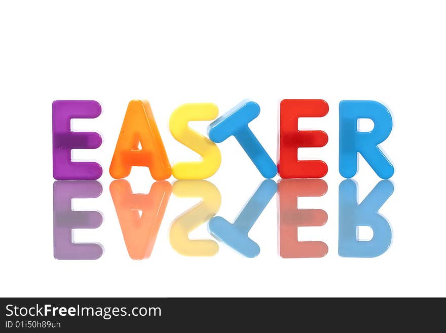 Easter word made with plastic letters isolated on white background