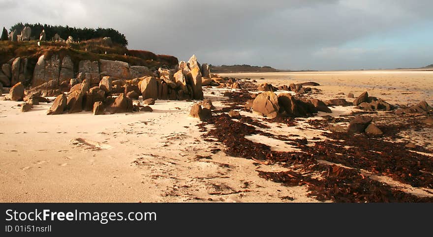 Rocky beach in low-tide on a stromy day. Rocky beach in low-tide on a stromy day.