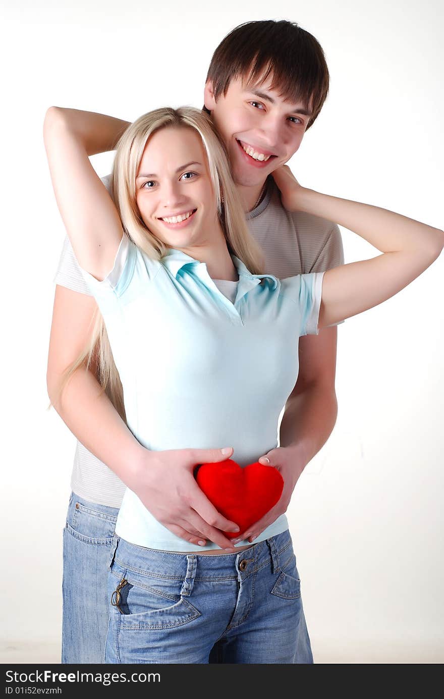 Young loving couple isolated at white background