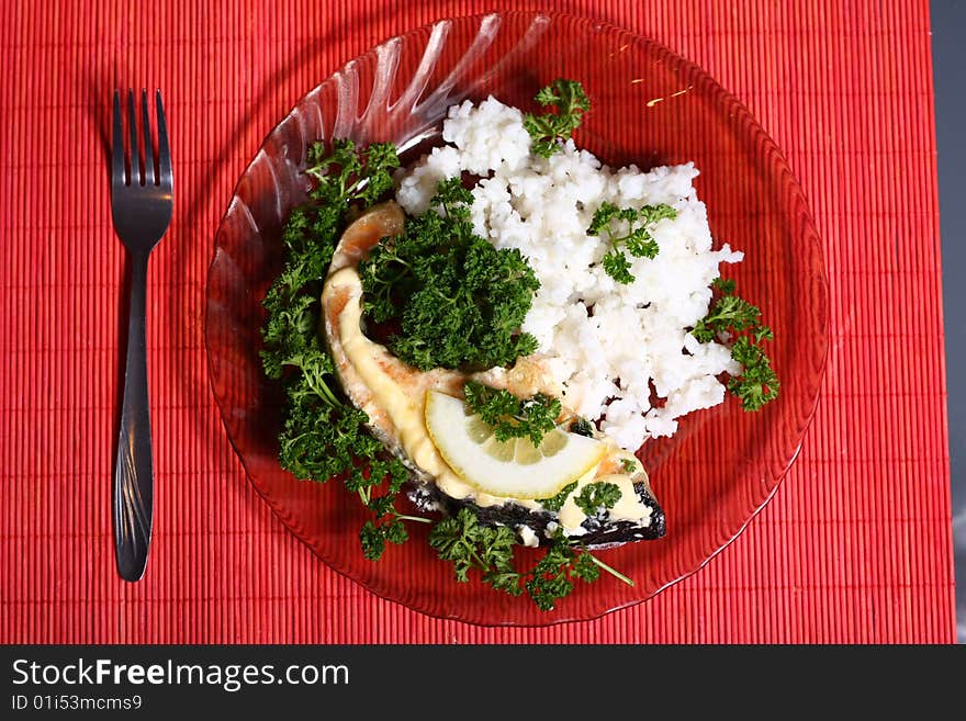 Plate with slice of salmon and rice. Plate with slice of salmon and rice