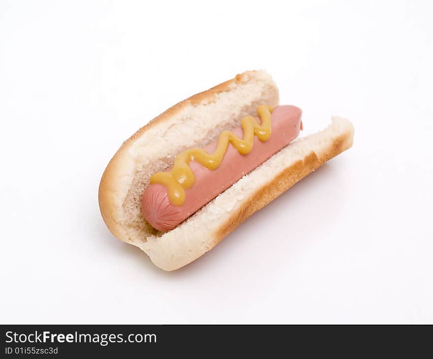 Hot dog with mustard isolated on a white background