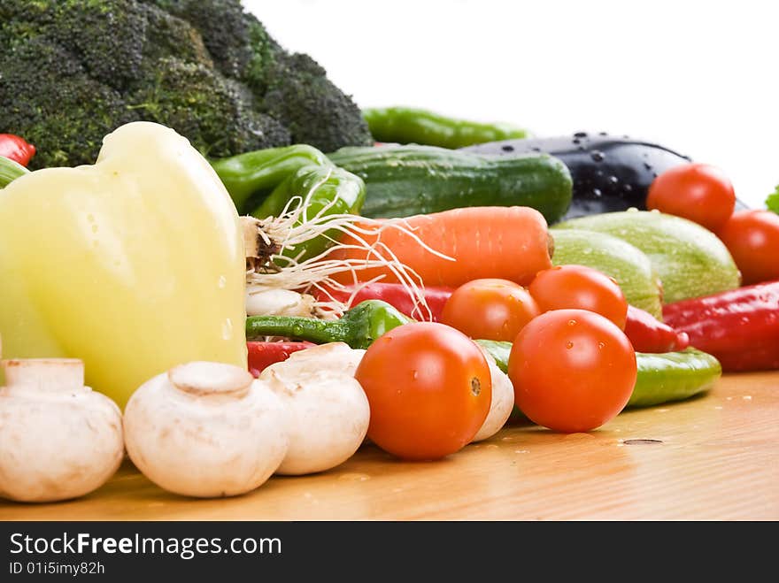 Close up of fresh vegetables on a wood table in kitchen,check also Healthy food