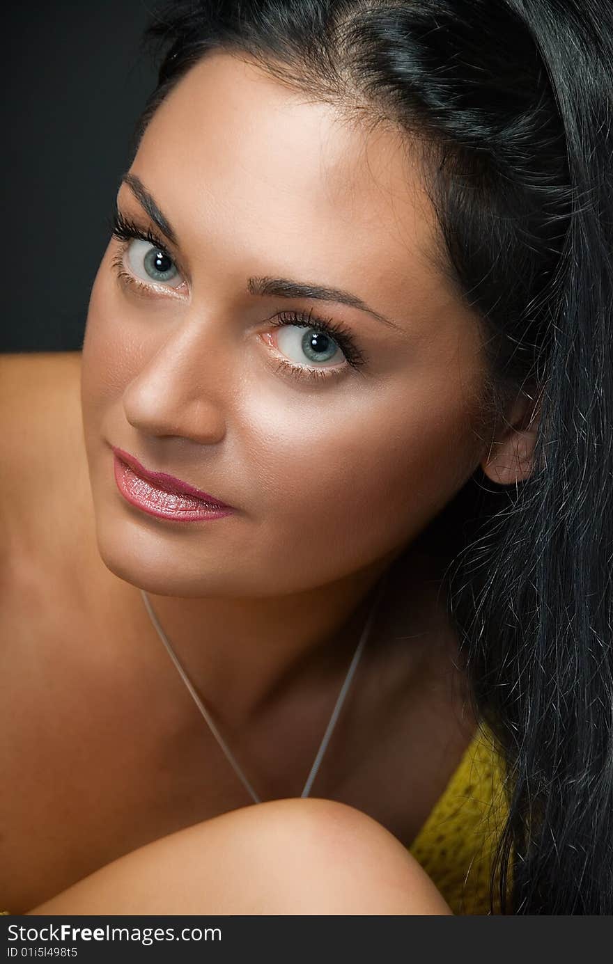 Portrait of charming young woman on black background. Portrait of charming young woman on black background